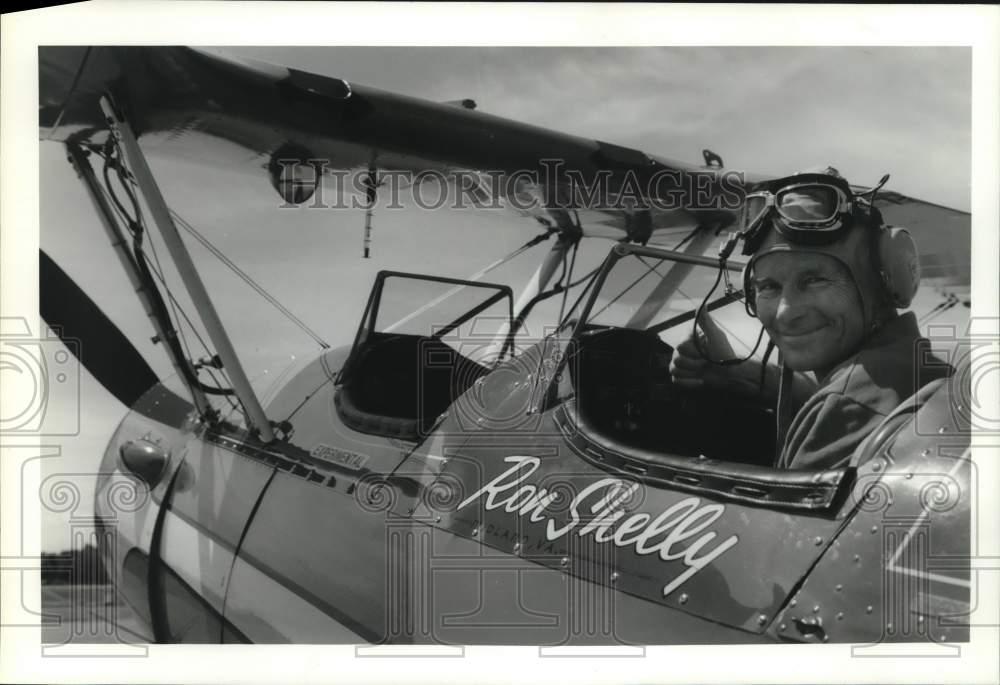 1991 Ron Shelly smiles from the Cockpit of his Bi-Plane-Historic Images