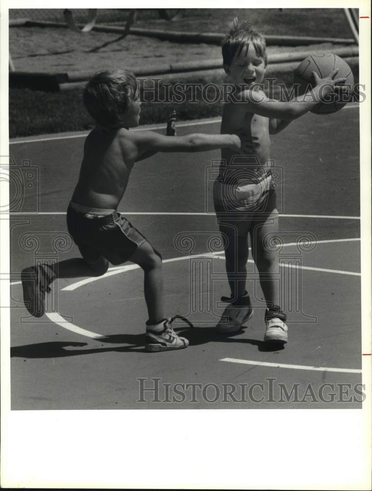 1988 Press Photo Danny James keeps Ball away from Scott Comfort at Dexter Park - Historic Images