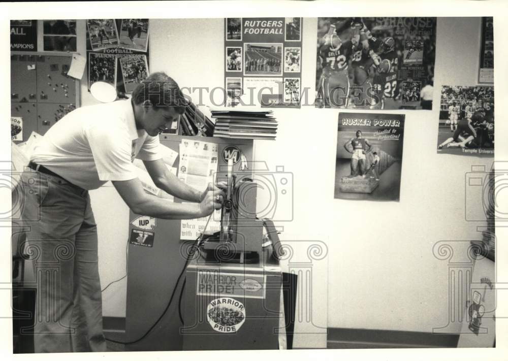 1986 Press Photo Randy Edsall with Football Memorabilia - sya90496- Historic Images