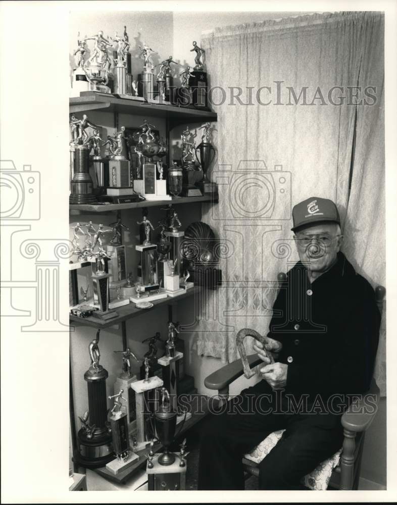 1989 Press Photo Anthony Sauro poses with Horseshoe Pitching Trophies- Historic Images