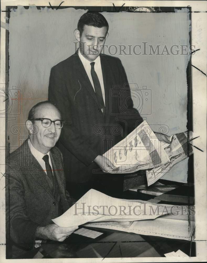 1967 Jack Rubenstein and Mel Rubenstein look over advertisements-Historic Images