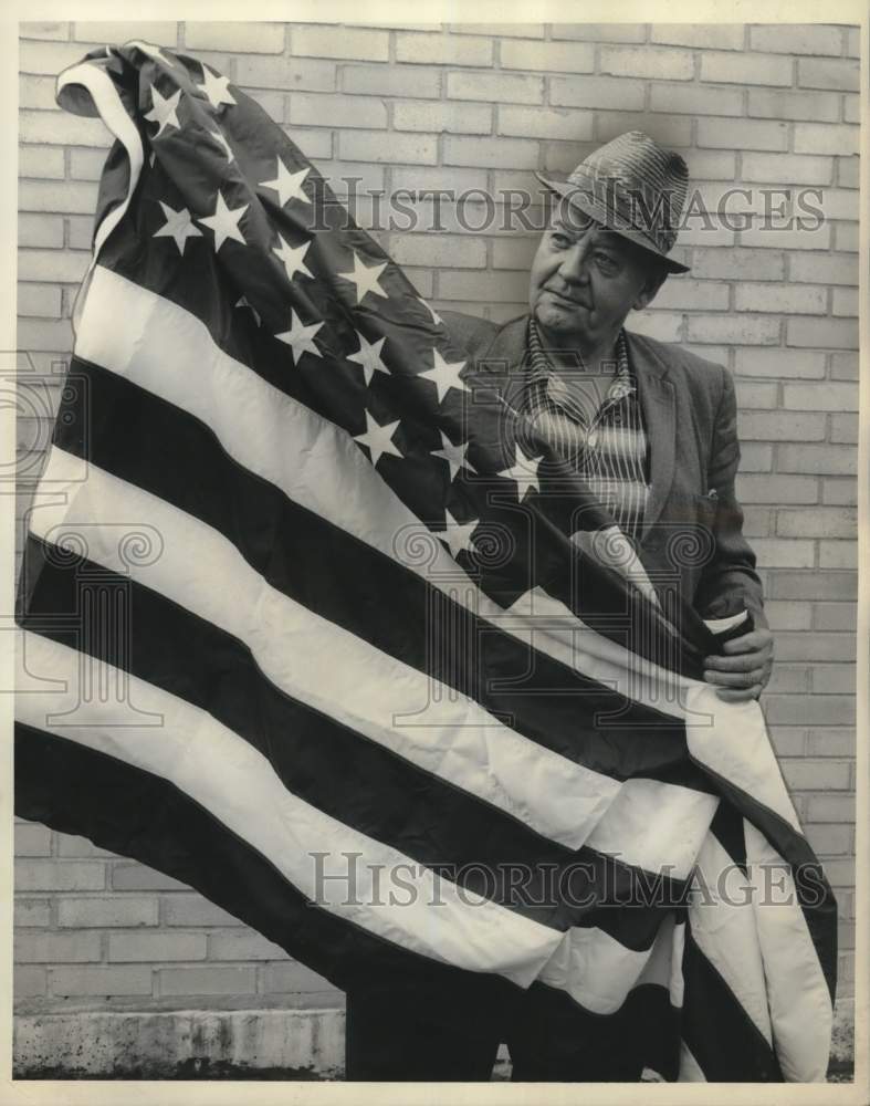 1962 Building superintendent Erich Nordheim prepares for Flag Day-Historic Images