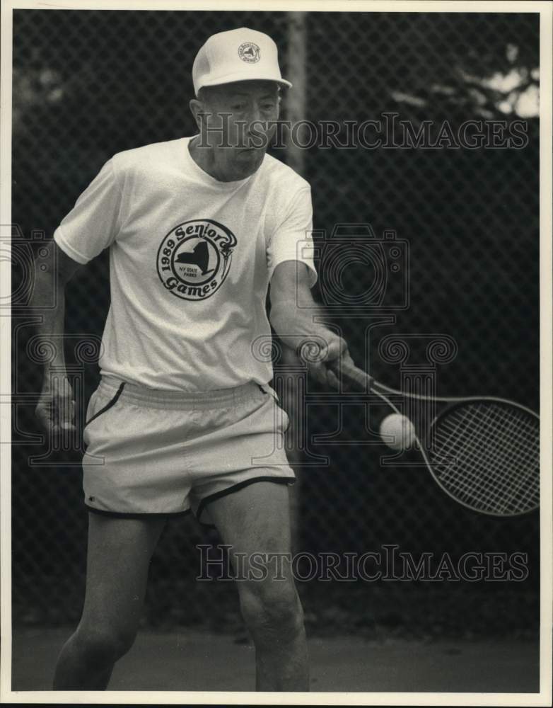 1989 Press Photo Warren Schlickenrieder Playing Tennis at Senior Games- Historic Images