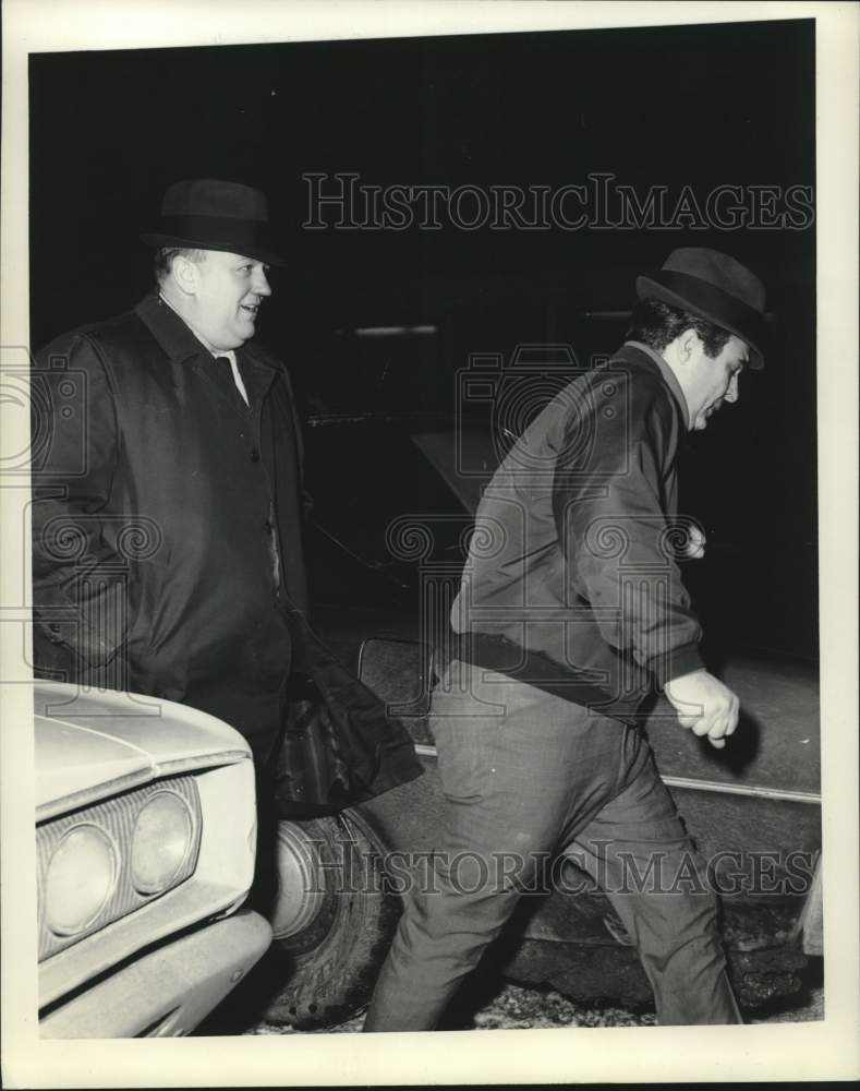 1969 Utica State Police officer Vito Sinisgalli (L) escorts prisoner-Historic Images