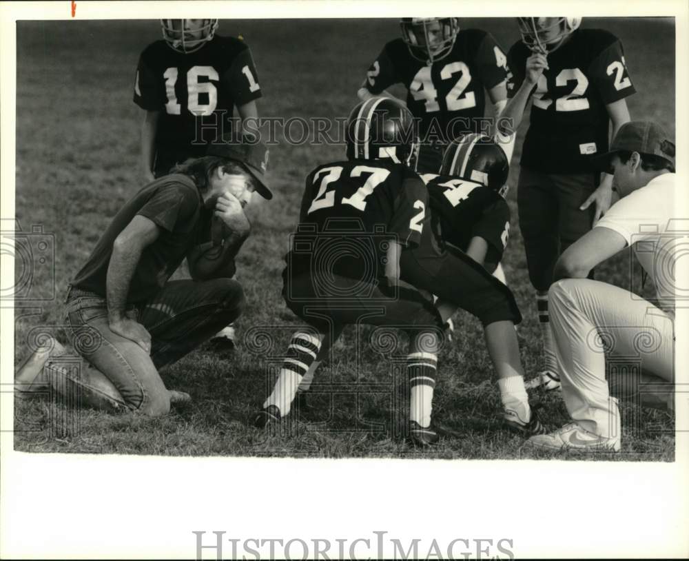 1989 Press Photo Pee Wee football coach Brian Bicknell watches players practice- Historic Images