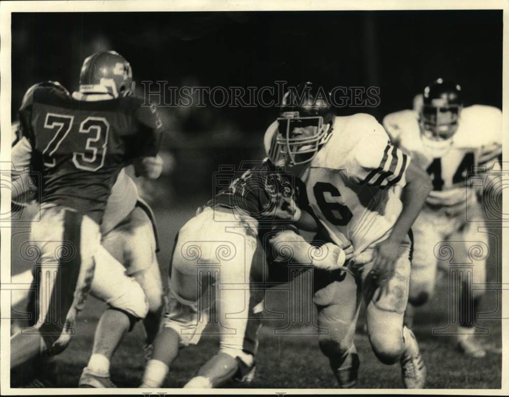 1985 Press Photo Dorsey Williams in Henninger Football Game with Opponents- Historic Images