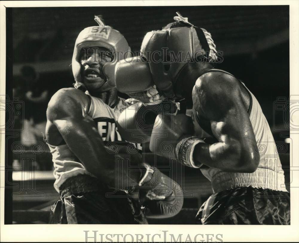 1988 Press Photo Two boxers battle during Empire State Games bout in New York - Historic Images