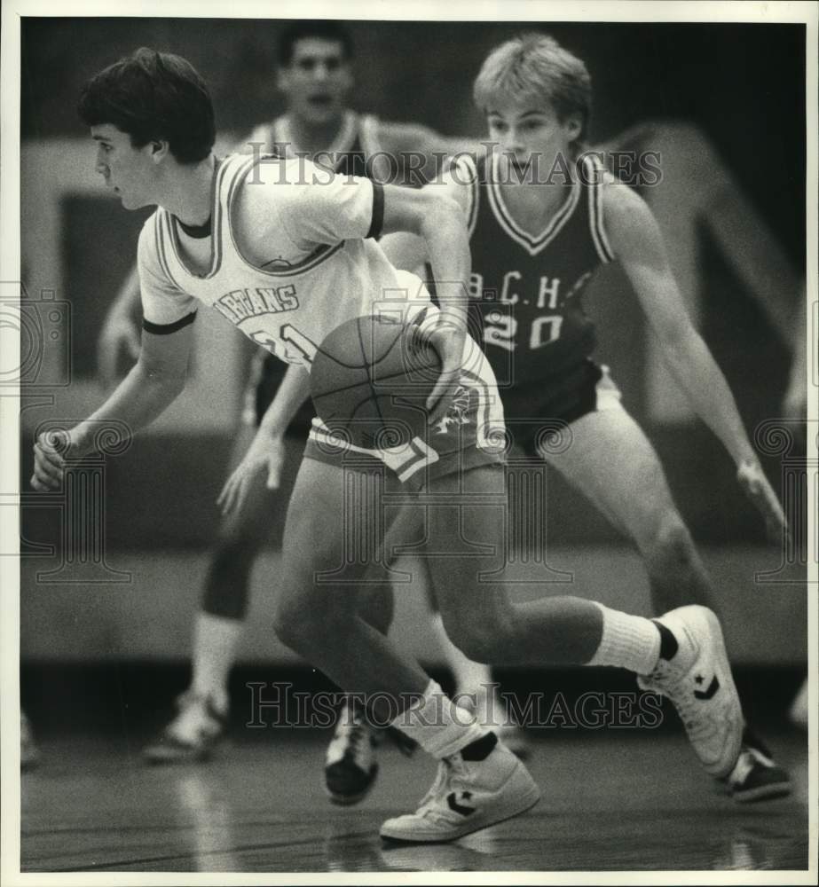 1986 Press Photo East Syracuse Minoa basketball player Steve Ghezzi dribbles - Historic Images