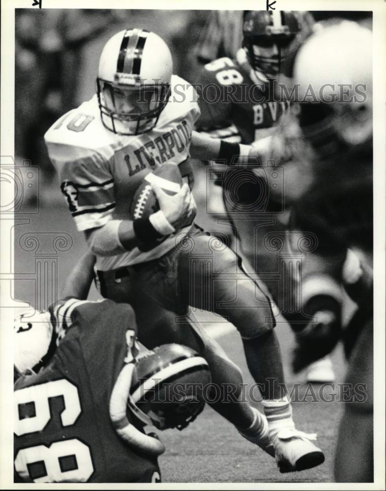 1989 Press Photo Baldwinsville&#39;s Jeff McCard tackling Liverpool&#39;s Matt McFee - Historic Images