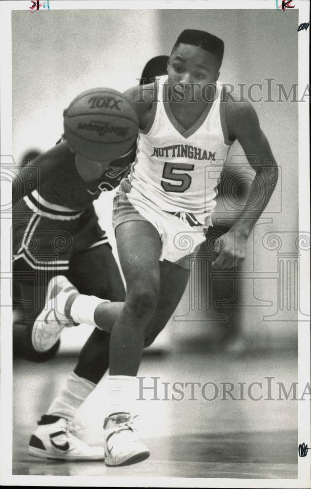 1987 Press Photo Nottingham's Craig Caldwell drives down basketball court. - Historic Images