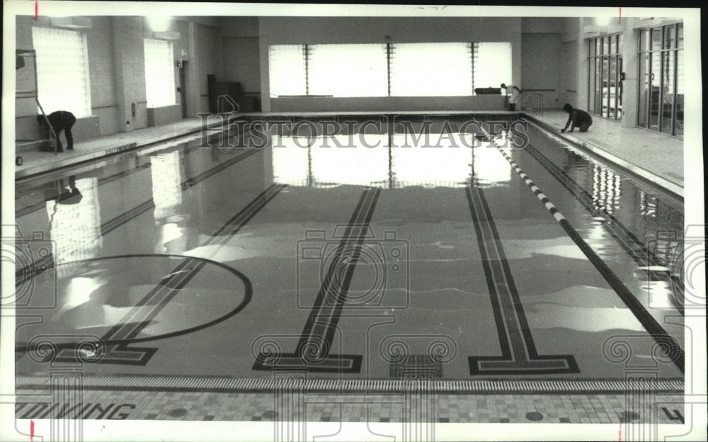 1990 Workers finishing up new pool at Albany, New York YMCA - Historic Images