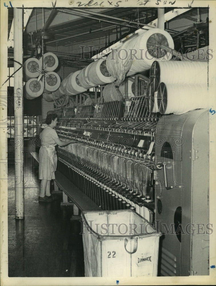 1961 Worker monitoring an industrial weaving loom - Historic Images