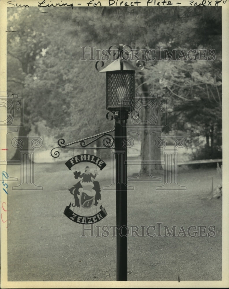 ZenZen family crest hangs from a lamp post-Historic Images