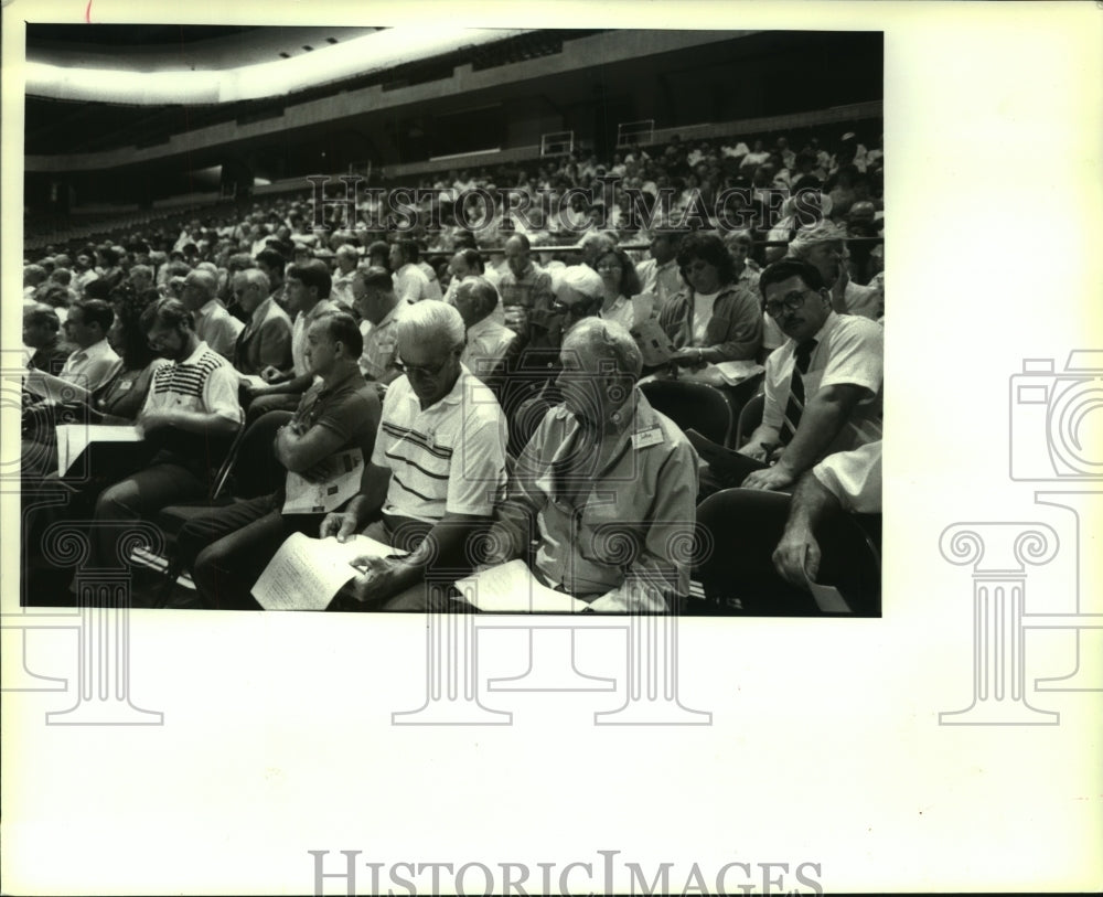 1990 Billy Graham Crusade users listen to instructions, Albany, NY - Historic Images