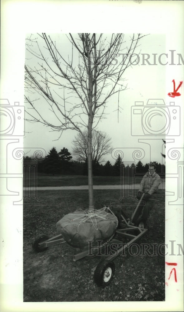 1993 Jim Healy with tree lifting invention, Edison Club Maintenance - Historic Images