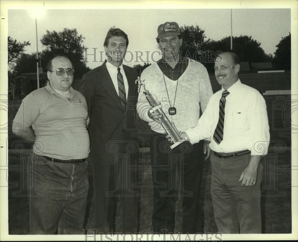 Press Photo Track coaches & officials display trophy - tua06989 - Historic Images