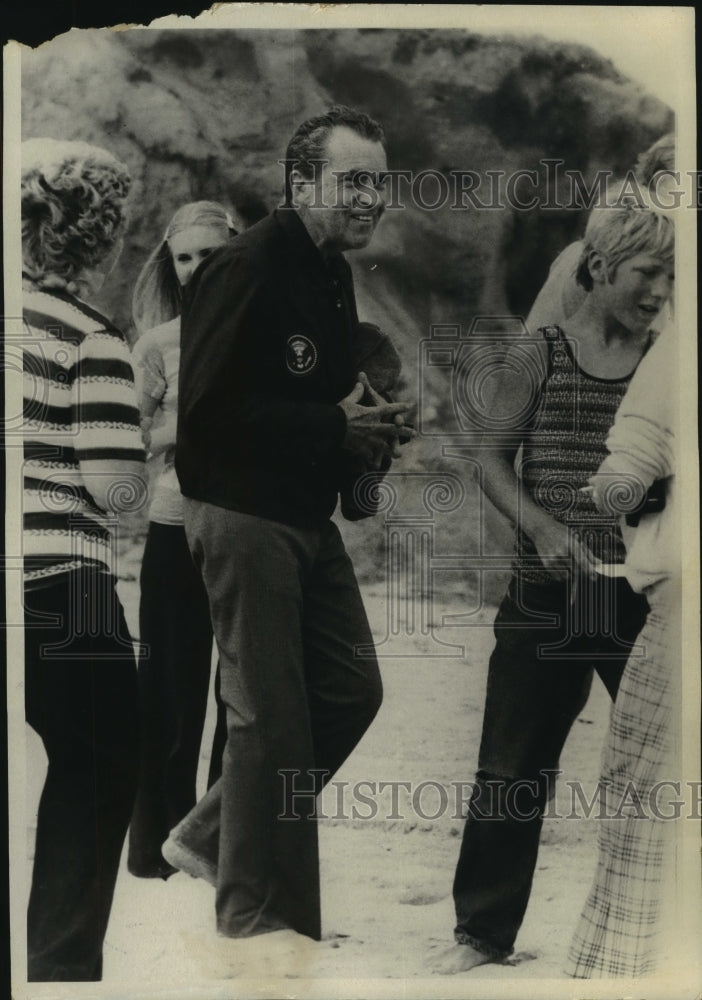 1975 Richard Nixon walking on California beach with daughter - Historic Images
