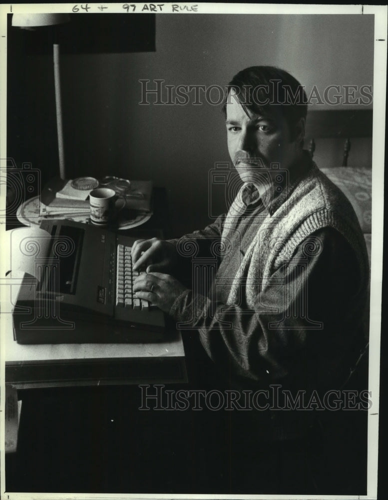 1991 Kevin George Murphy at typewriter, 345 Madison Avenue, Albany - Historic Images