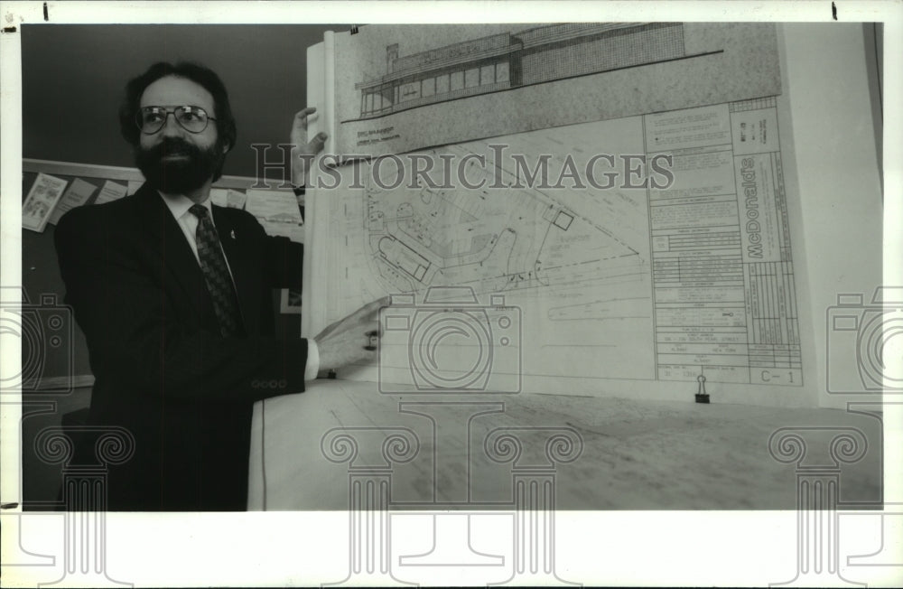 1994 Albany City Planner Rich Nicholson holds McDonalds blueprint - Historic Images