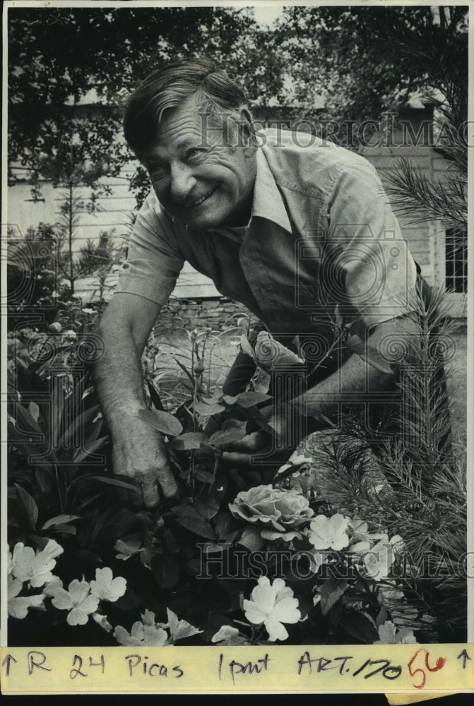 1977 Thomas E. Mulligan tending his garden - Historic Images