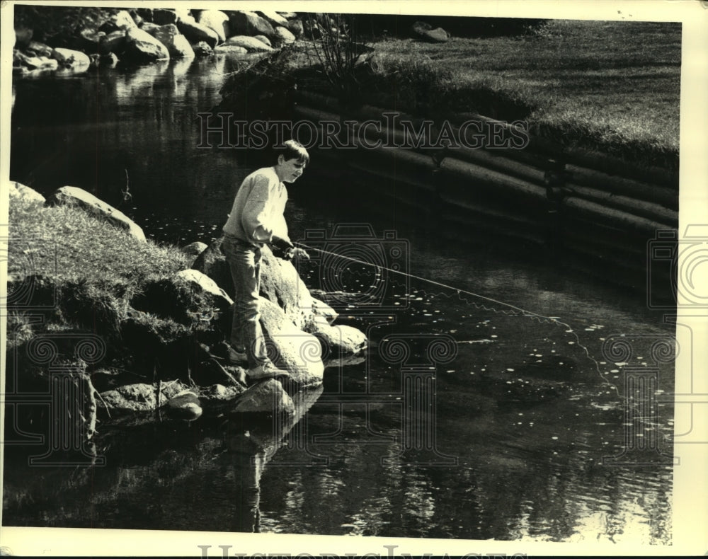 1988 Rickey Mangona fishing in Saratoga State Park, New York - Historic Images