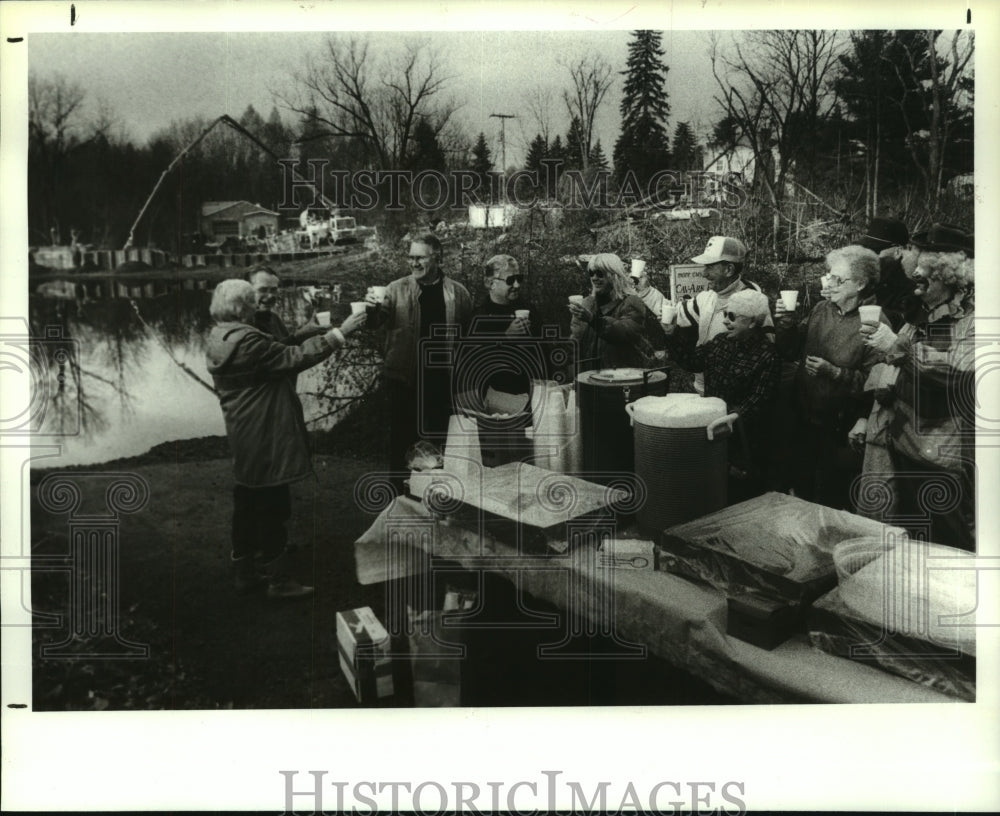 1989 Niverville, New York residents toast repair of Kinderhook Dam - Historic Images