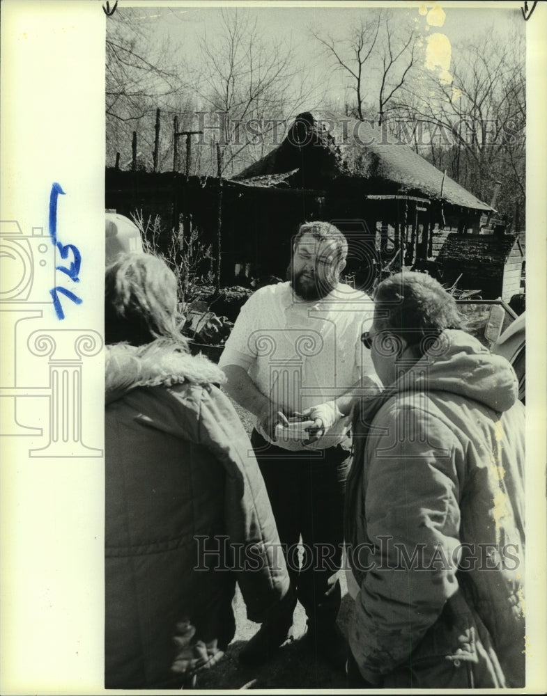 1985 Residents in front of fire-damaged Nassau, New York home - Historic Images