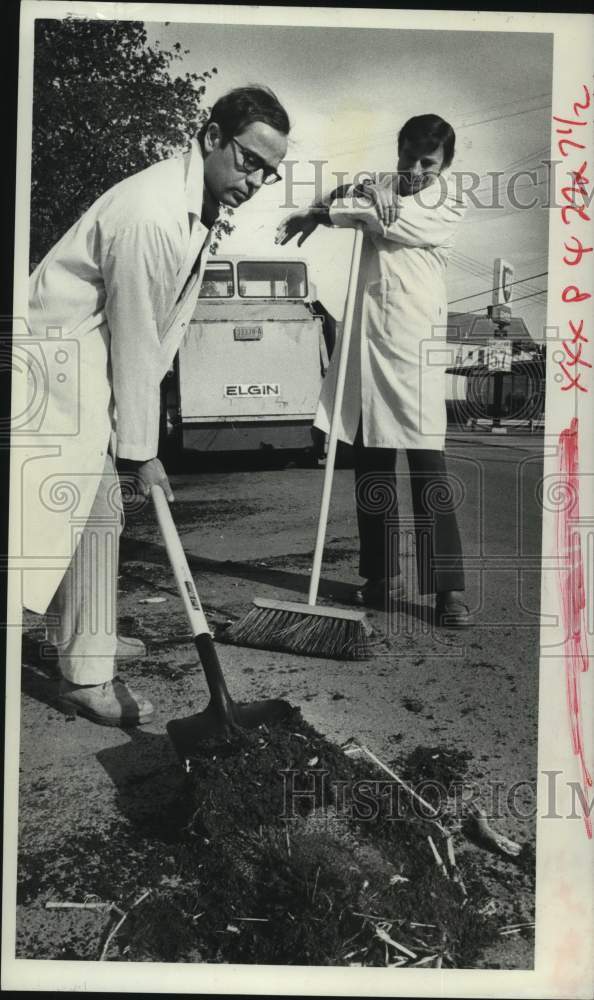 1978 Schenectady, New York men shovel dirt during clean up program - Historic Images