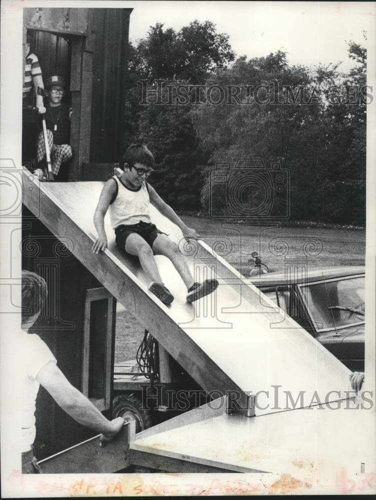 1980 Westland Hills Park playground equipment, Les Guynup on slide - Historic Images