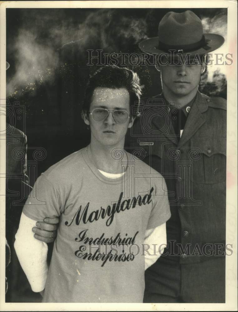 1984 Rickie Nolen with unnamed police officer - Historic Images