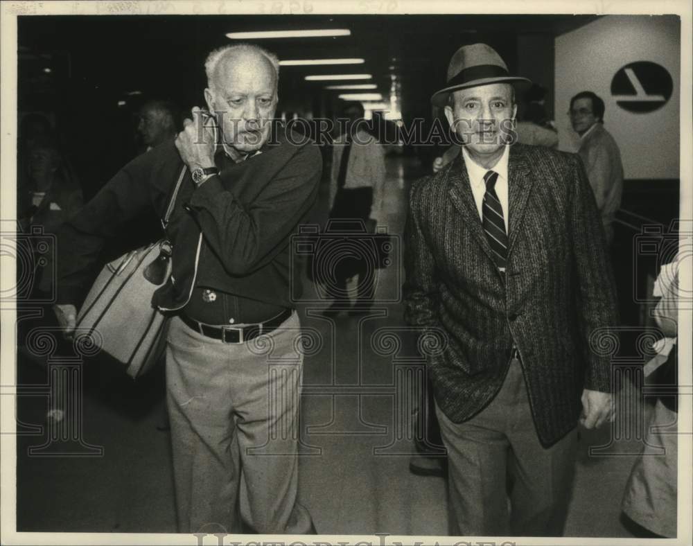 1984 Robert Aline and Henry Nofal walk from Gate 6, Albany Airport - Historic Images