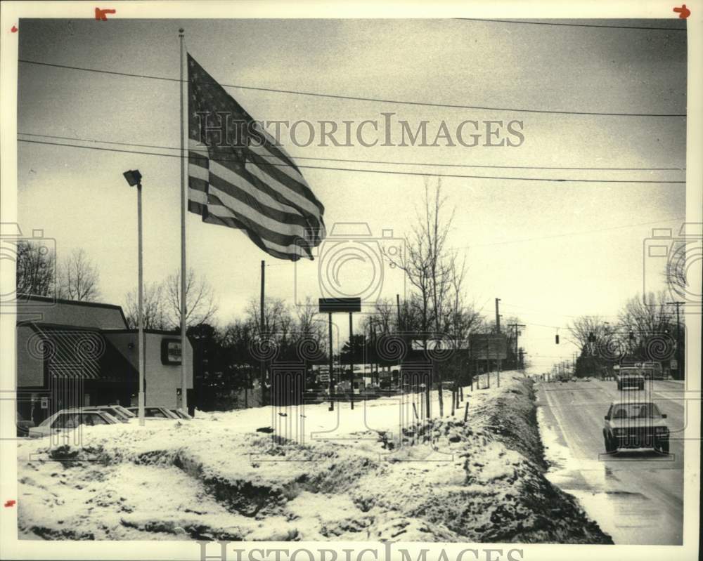 1986 American flag in front of Ponderosa, Rt 20, Western Avenue NY - Historic Images