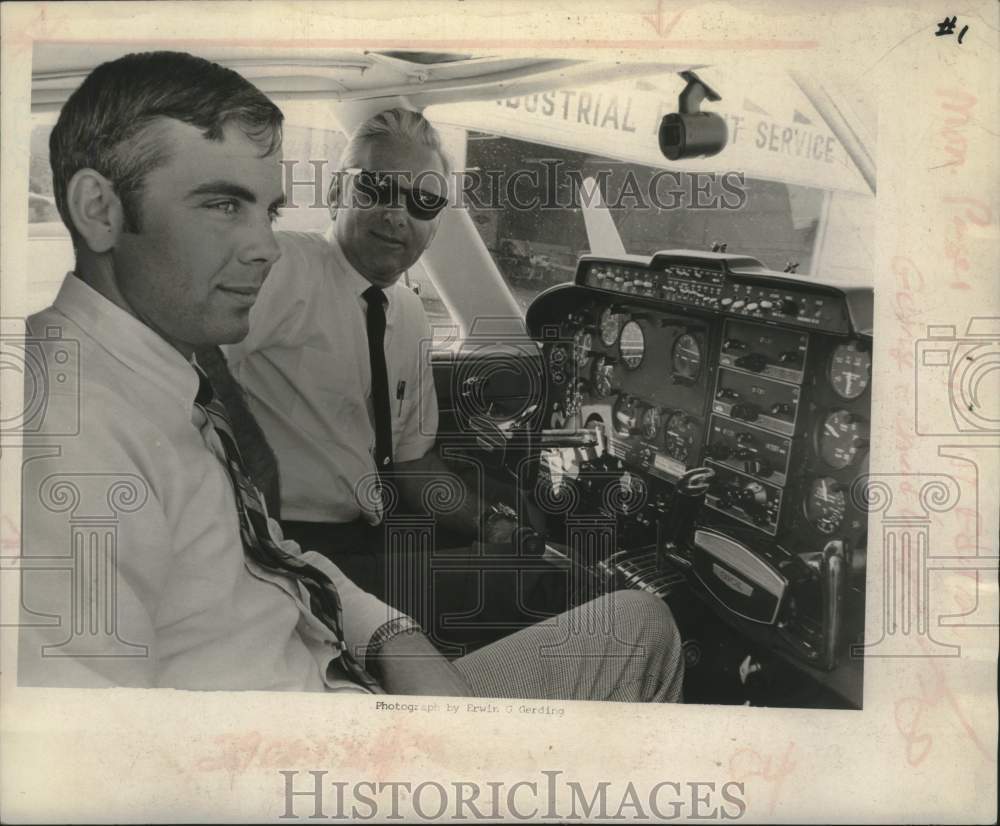 1969 George and David West in cockpit of airplane - Historic Images