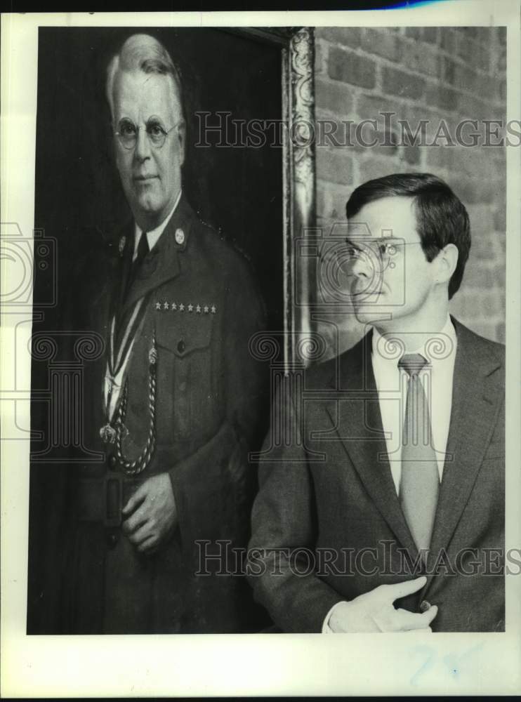 1987 Press Photo Thomas West with portrait of his grandfather, Albany, New York - Historic Images
