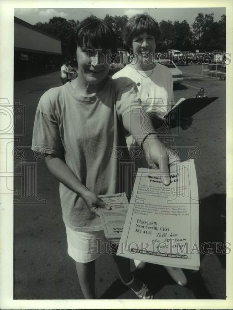 1993 Press Photo Jane French and Georgia Hebert, both RN&#39;s, with protest flyers - Historic Images