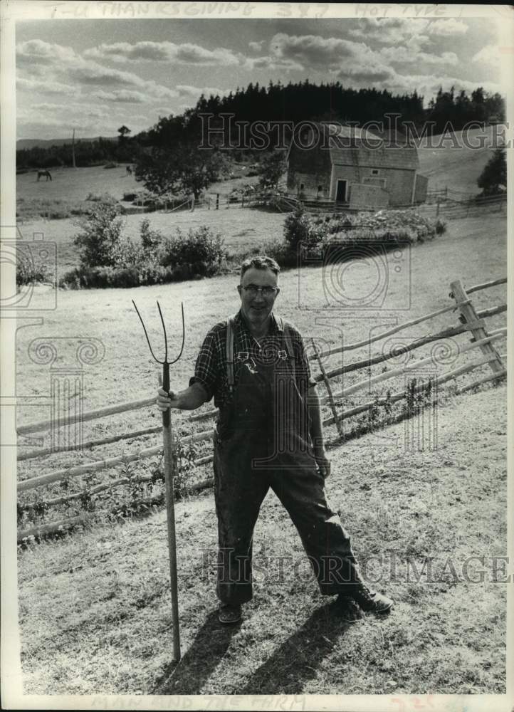 Press Photo Farmer poses for photograph in Nova Scotia, Canada - tua14745 - Historic Images