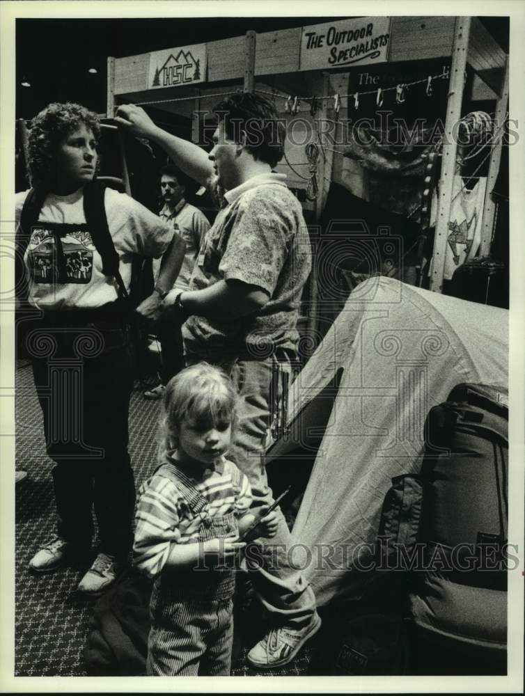 1989 Press Photo Vermont woman fitted with backpack at Albany, New York expo - Historic Images