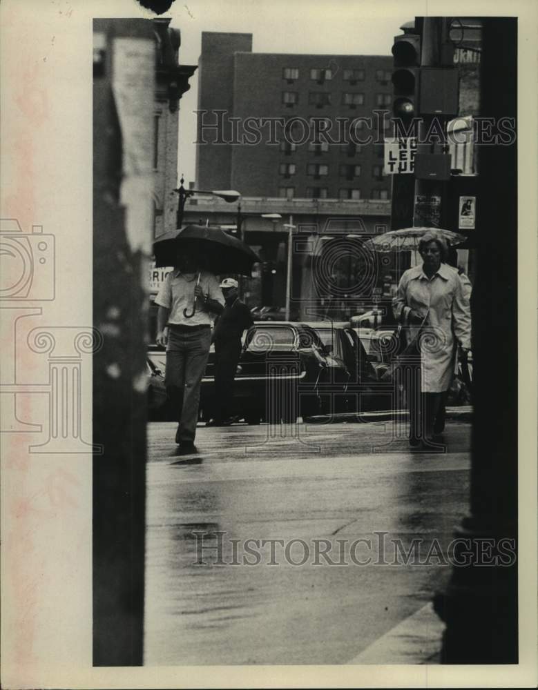 1976 Pedestrians brave rain along North Pearl Street, Albany, NY - Historic Images