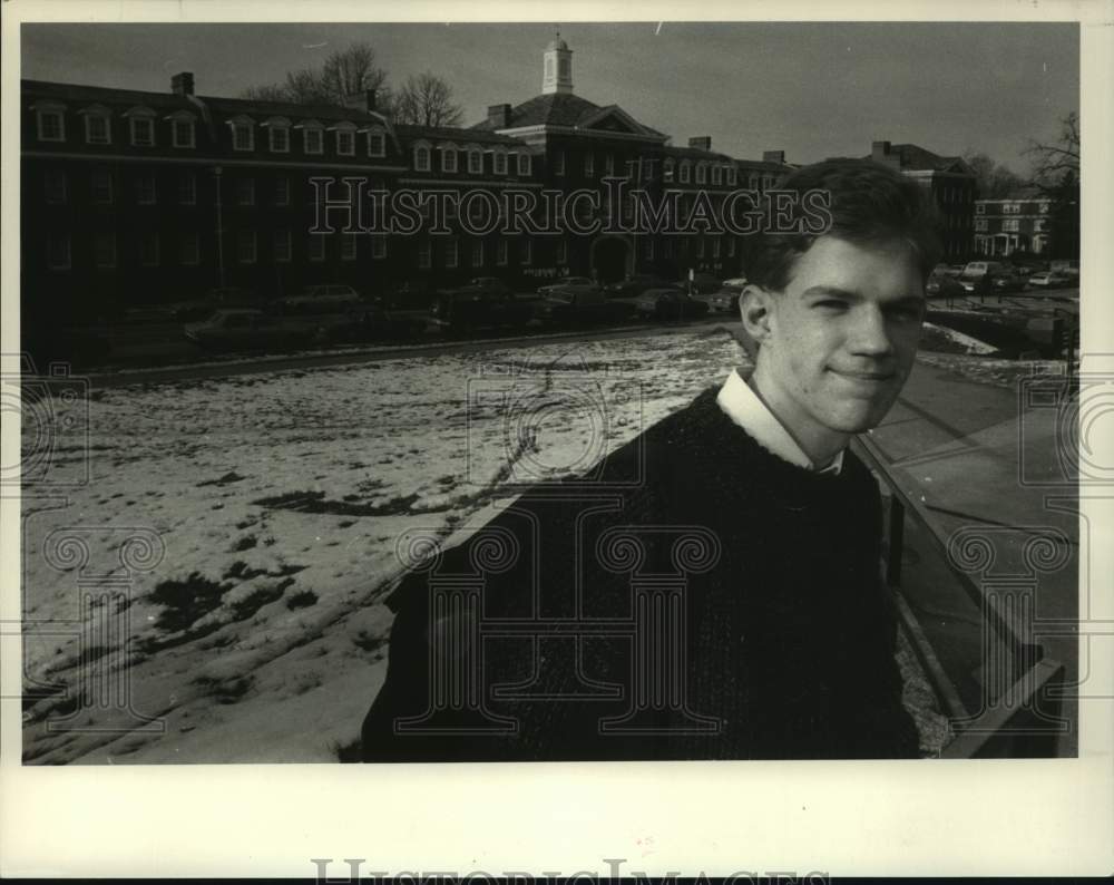 1988 Press Photo Adrian Scott, 15 year old RPI student in front of school. - Historic Images