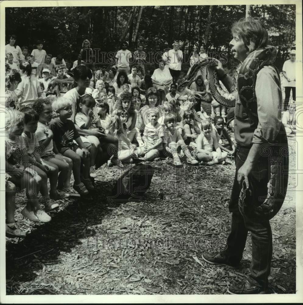 1990 Press Photo Andrew Simmons shows snake at Troy, New York education program - Historic Images