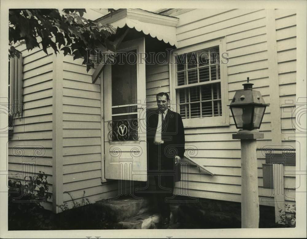 Press Photo Man standing in doorway of New York residence - tua15407 - Historic Images