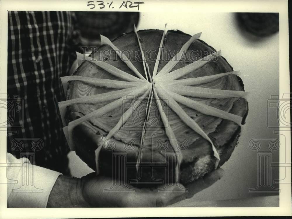 1985 J and S Watkins, person holding cheesecake-Historic Images