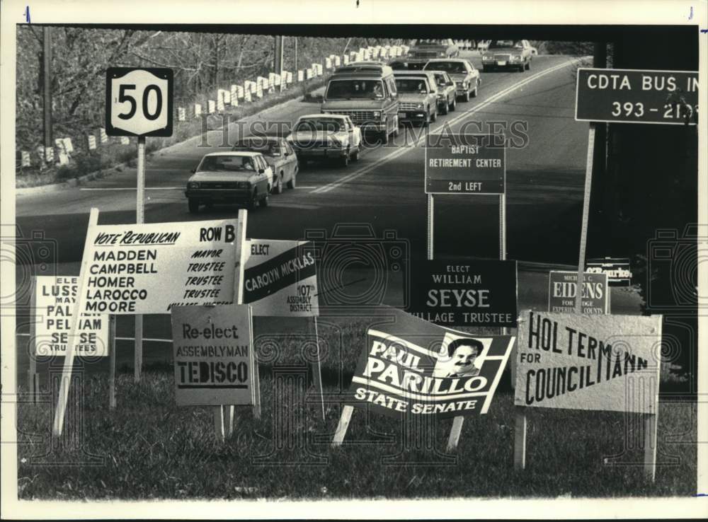 1986 Political signs crowd Scotia, New York intersection - Historic Images