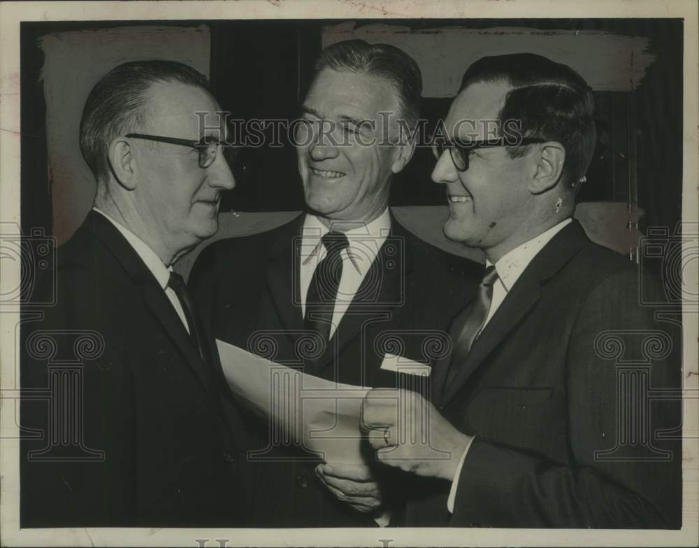 1964 Russel W Scofield (center) discusses city tax increase - Historic Images