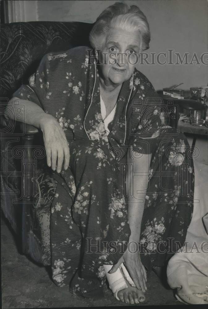 1960 Mrs. Irene Morrison holds injured foot, Schenectady, New York - Historic Images