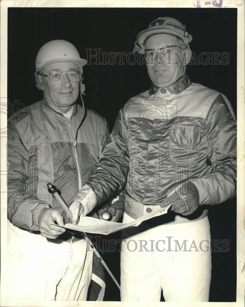 Jockeys Howard Parker (left) and Stanley Dancer pose for photo - Historic Images