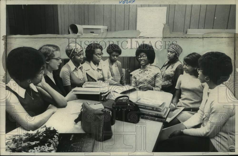 1970 Miss Patchechole Poiindexter sits around table with other women - Historic Images