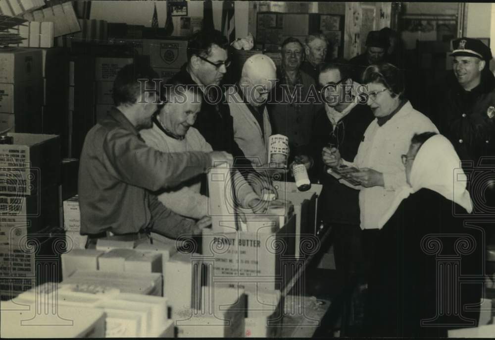 People pack food for Schoharie, New York surplus food program - Historic Images