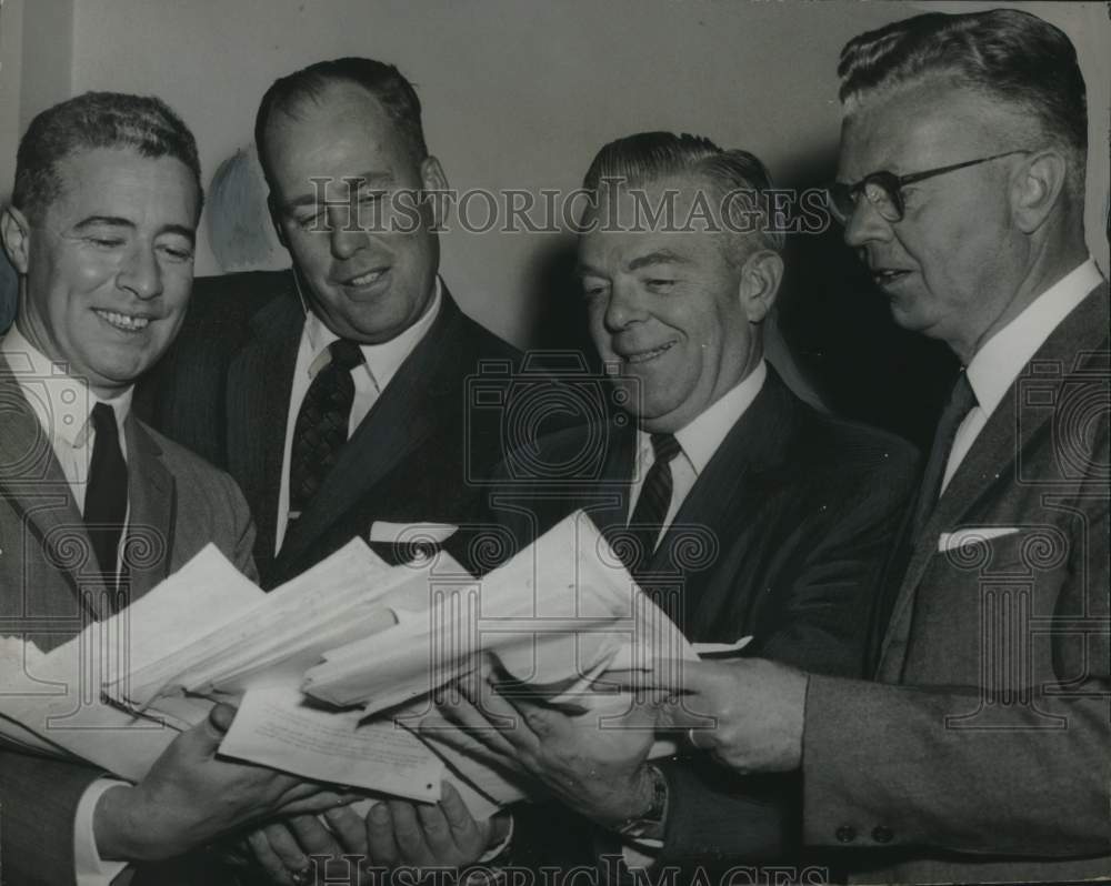 1960 Congressman Leo O'Brien reviews petitions protesting gas taxes - Historic Images