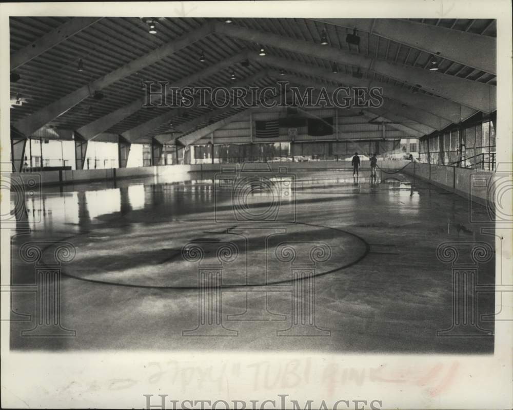 Press Photo Three men spray water down at Watervliet NY ice rink - tua22457-Historic Images